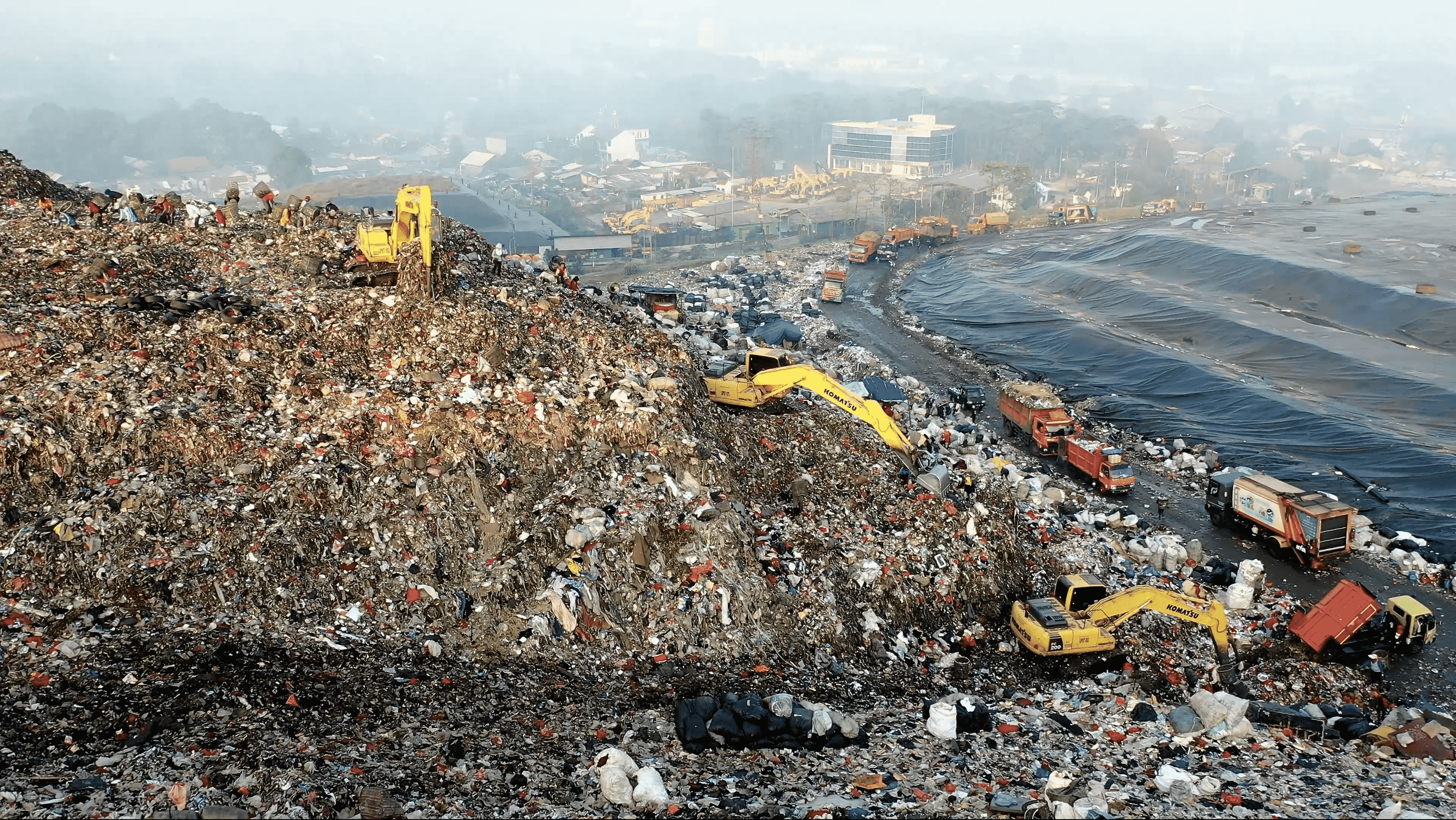landfill with excavators working on it